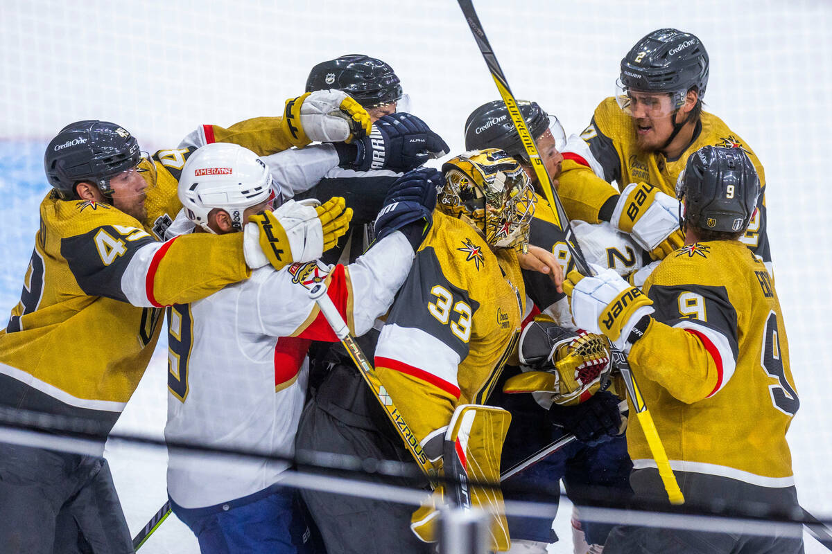 Golden Knights and Florida Panthers players fight during the first period in Game 1 of the NHL ...