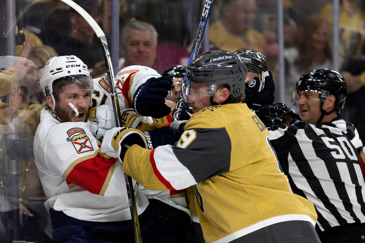 Florida Panthers left wing Matthew Tkachuk (19) swings at Golden Knights center Jack Eichel (9) ...