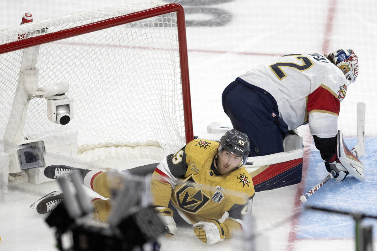 Golden Knights center Ivan Barbashev (49) reacts after sliding into the net while shooting on F ...