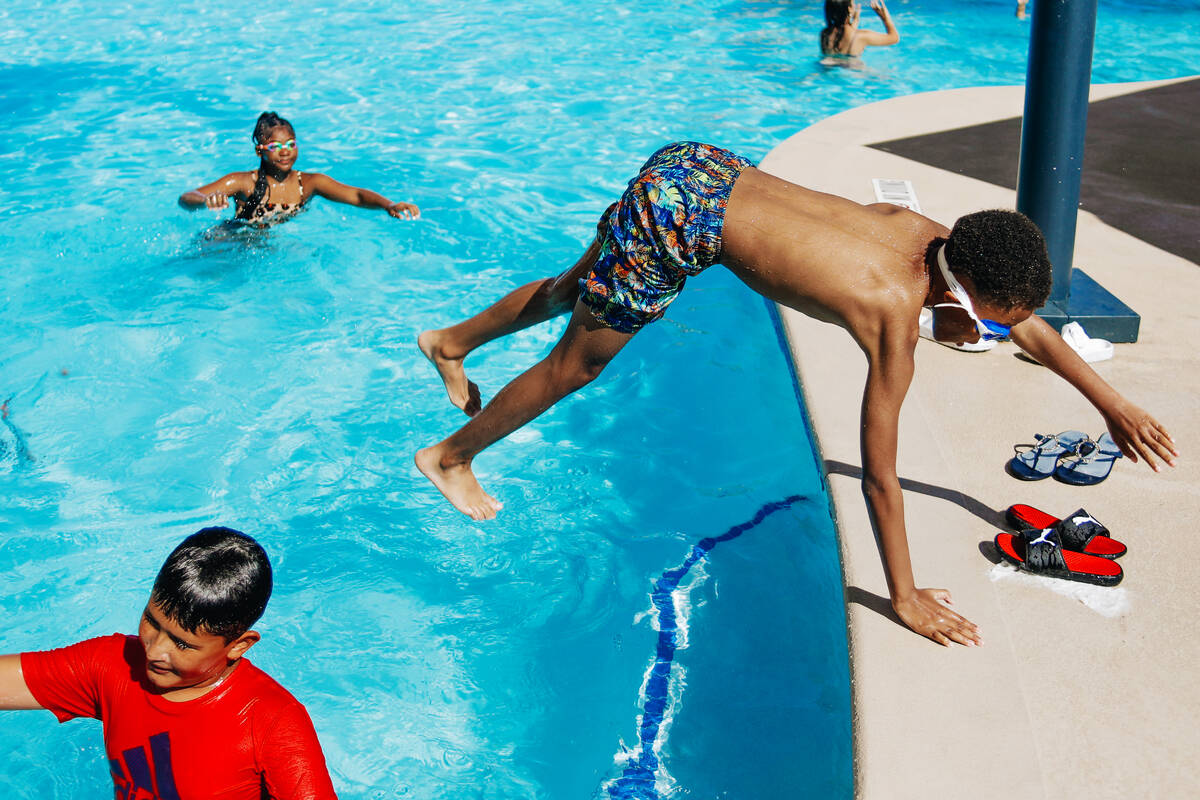 Terell Durham jumps into the pool on Friday, June 30, 2023, at the Swim and Social pool at the ...