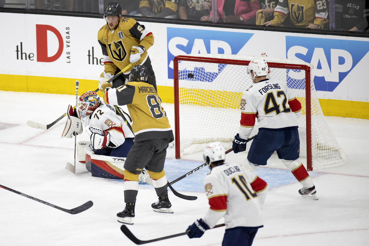 Golden Knights defenseman Alec Martinez, out of frame at left, scores on Florida Panthers goalt ...