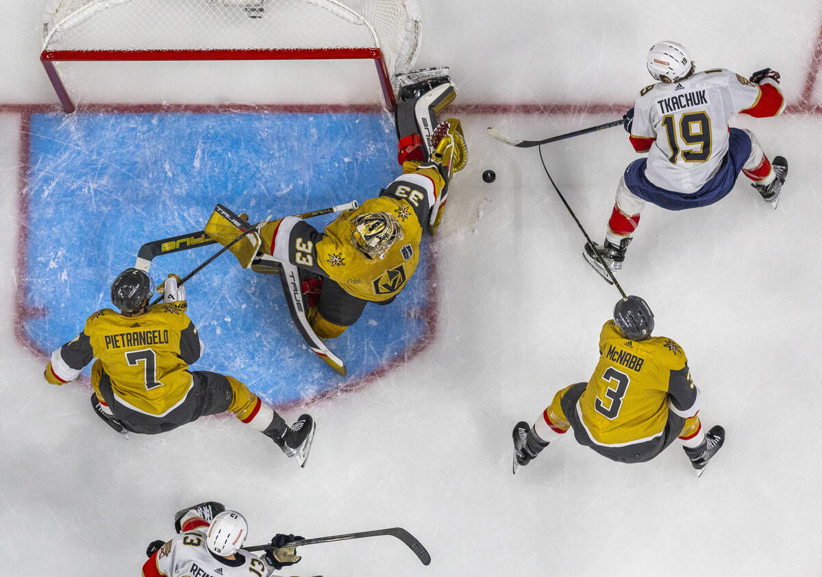 Golden Knights goaltender Adin Hill (33) rejects a shot by Florida Panthers left wing Matthew T ...