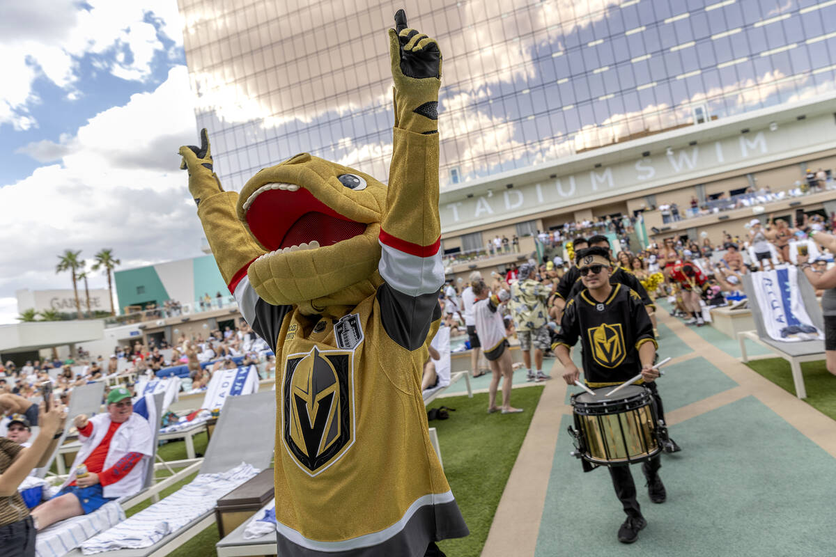 Golden Knights mascot Chance the Gila monster makes an appearance during a watch party for Game ...