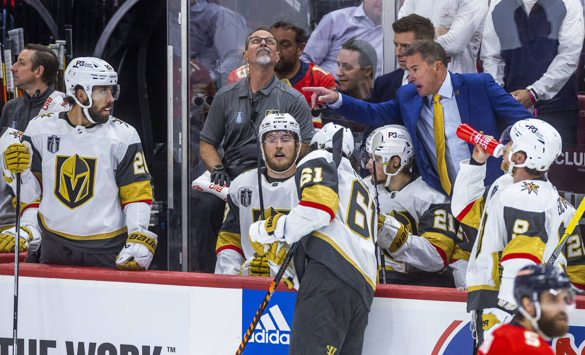 Golden Knights head coach Bruce Cassidy instructs center Chandler Stephenson (20) and teammates ...