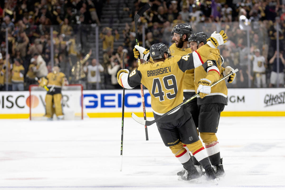 Golden Knights center Ivan Barbashev (49), defenseman Zach Whitecloud (2) and defenseman Nicola ...