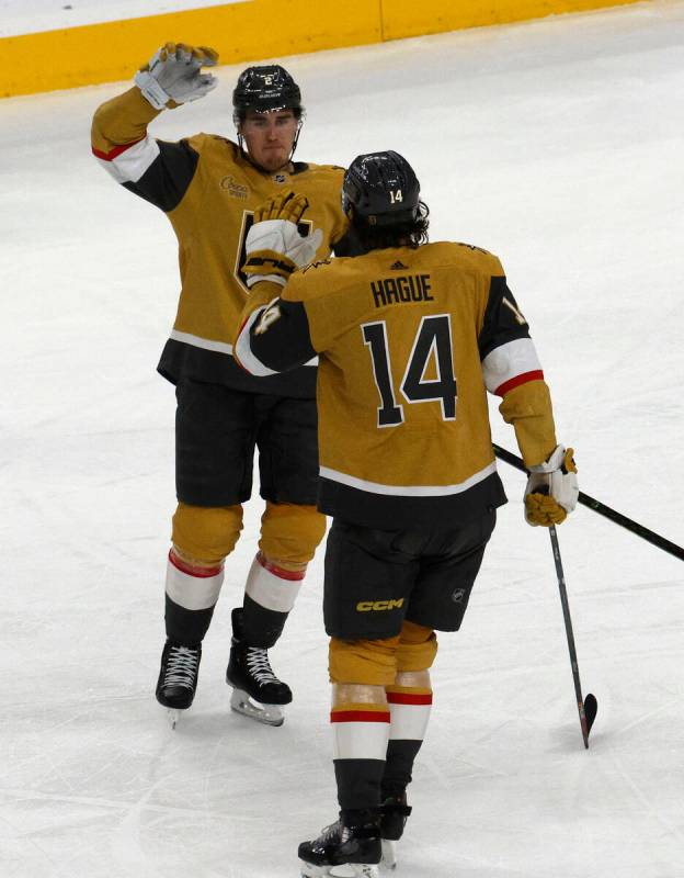 Vegas Golden Knights defenseman Zach Whitecloud (2) receives a high-five from Vegas Golden Knig ...