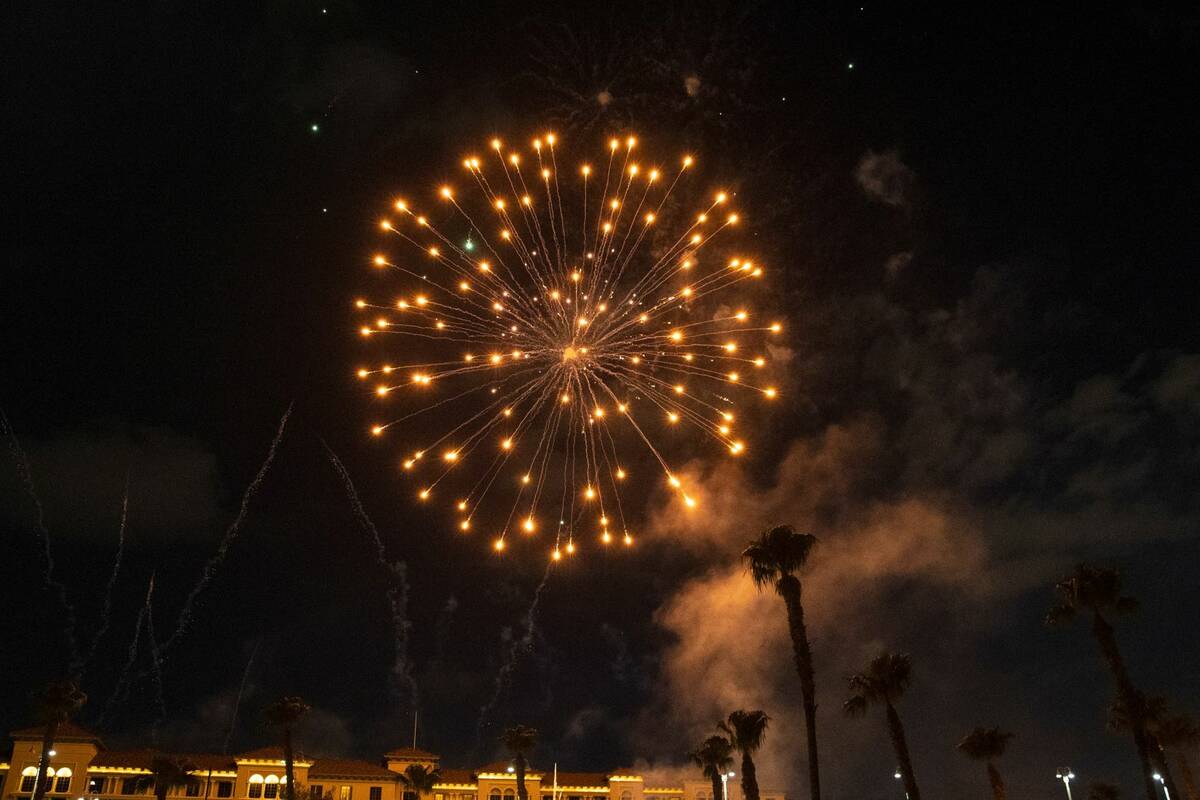 Fireworks go off above the Green Valley Ranch, on Sunday, July 4, 2021, in Henderson. (Bizuayeh ...