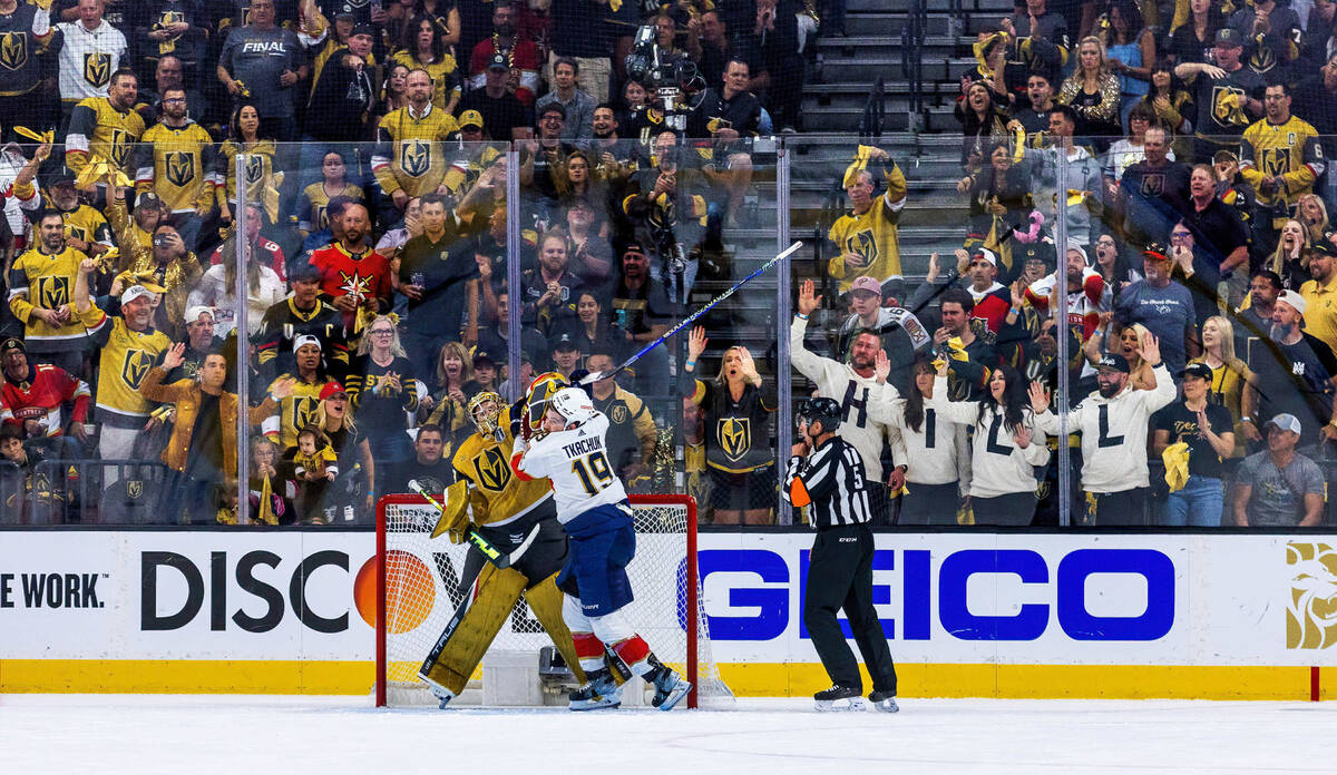 Golden Knights goaltender Adin Hill (33) defends himself from aggression by Florida Panthers le ...