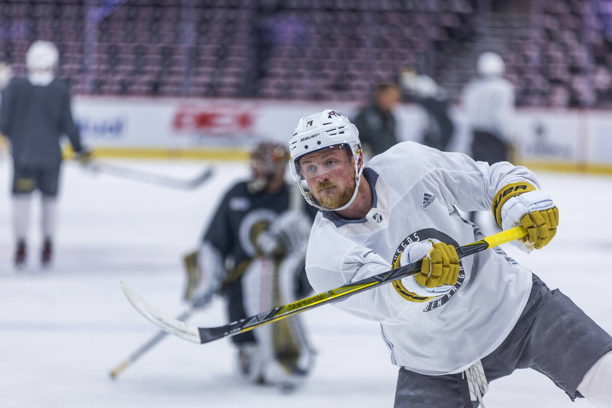 Golden Knights center Jack Eichel (9) takes a shot at the net defended by goaltender Adin Hill ...