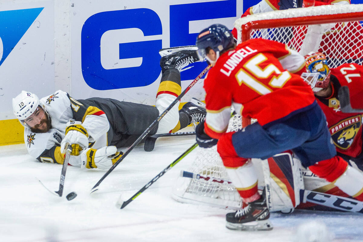 Golden Knights center Nicolas Roy (10) still attempts to pass from the ice past Florida Panther ...