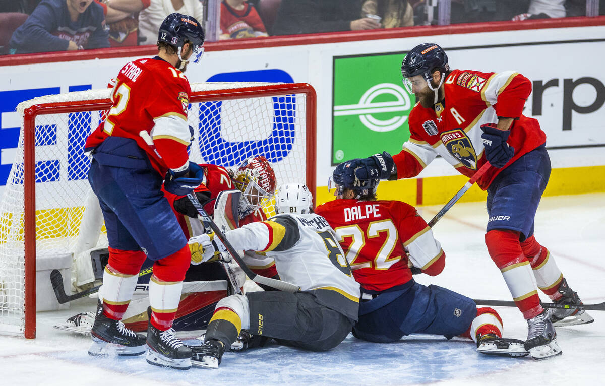 Golden Knights right wing Jonathan Marchessault (81) gets caught in the scrum as Florida Panthe ...