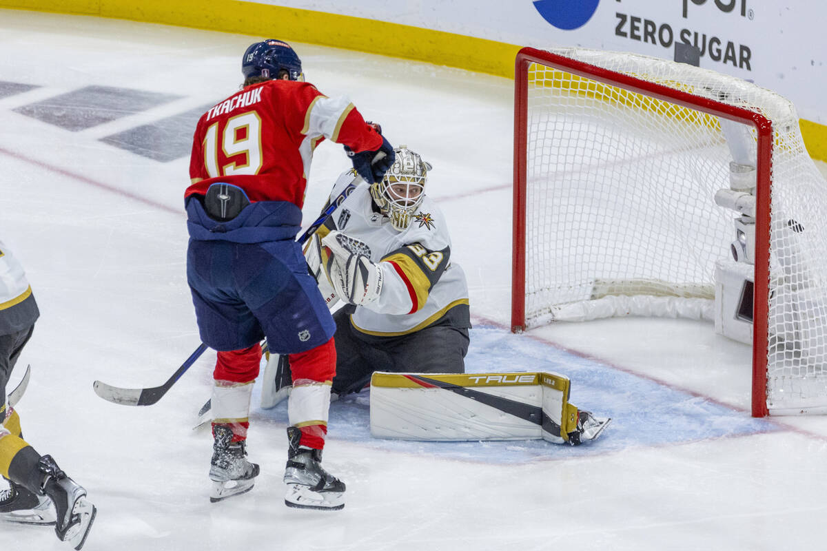 Golden Knights goaltender Adin Hill (33) looks back as a goal hits the net with Florida Panther ...