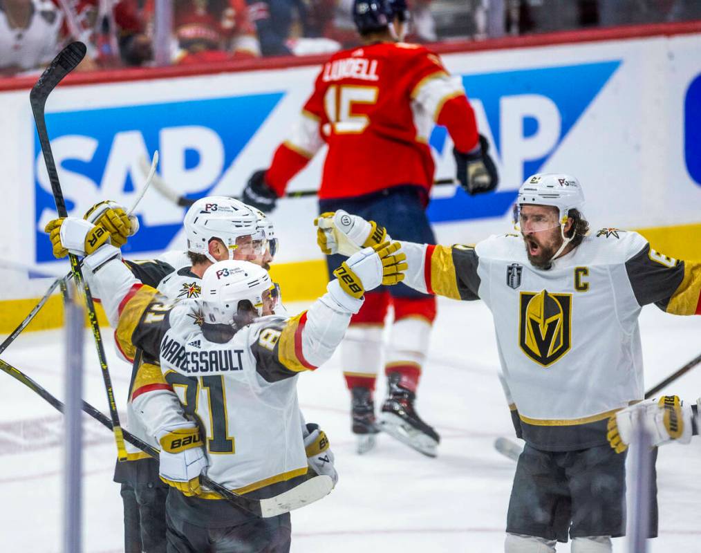 Golden Knights right wing Mark Stone (61) comes to celebrate a goal with right wing Jonathan Ma ...