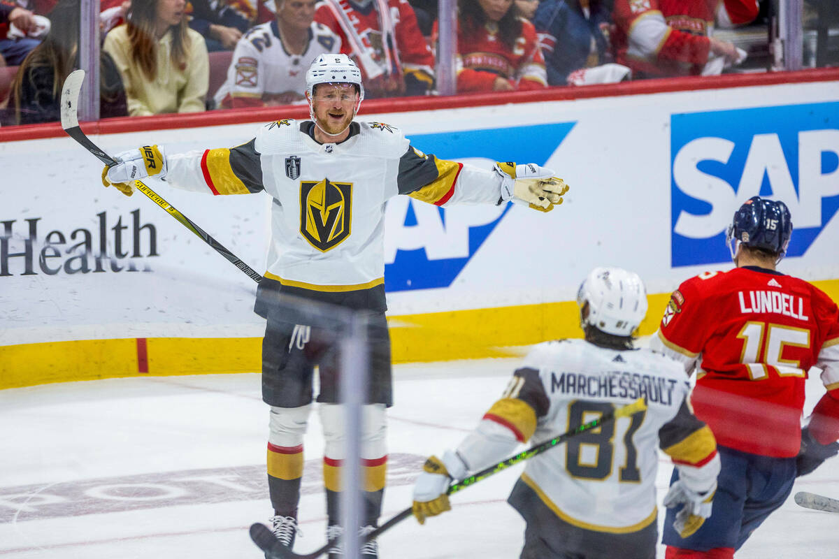 Golden Knights center Jack Eichel (9) celebrates a score with right wing Jonathan Marchessault ...