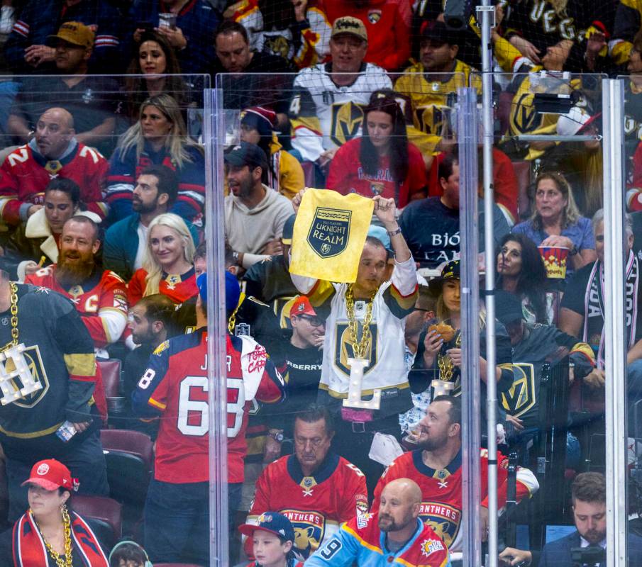 Golden Knights fans celebrate their first goal against the Florida Panthers in period one of Ga ...