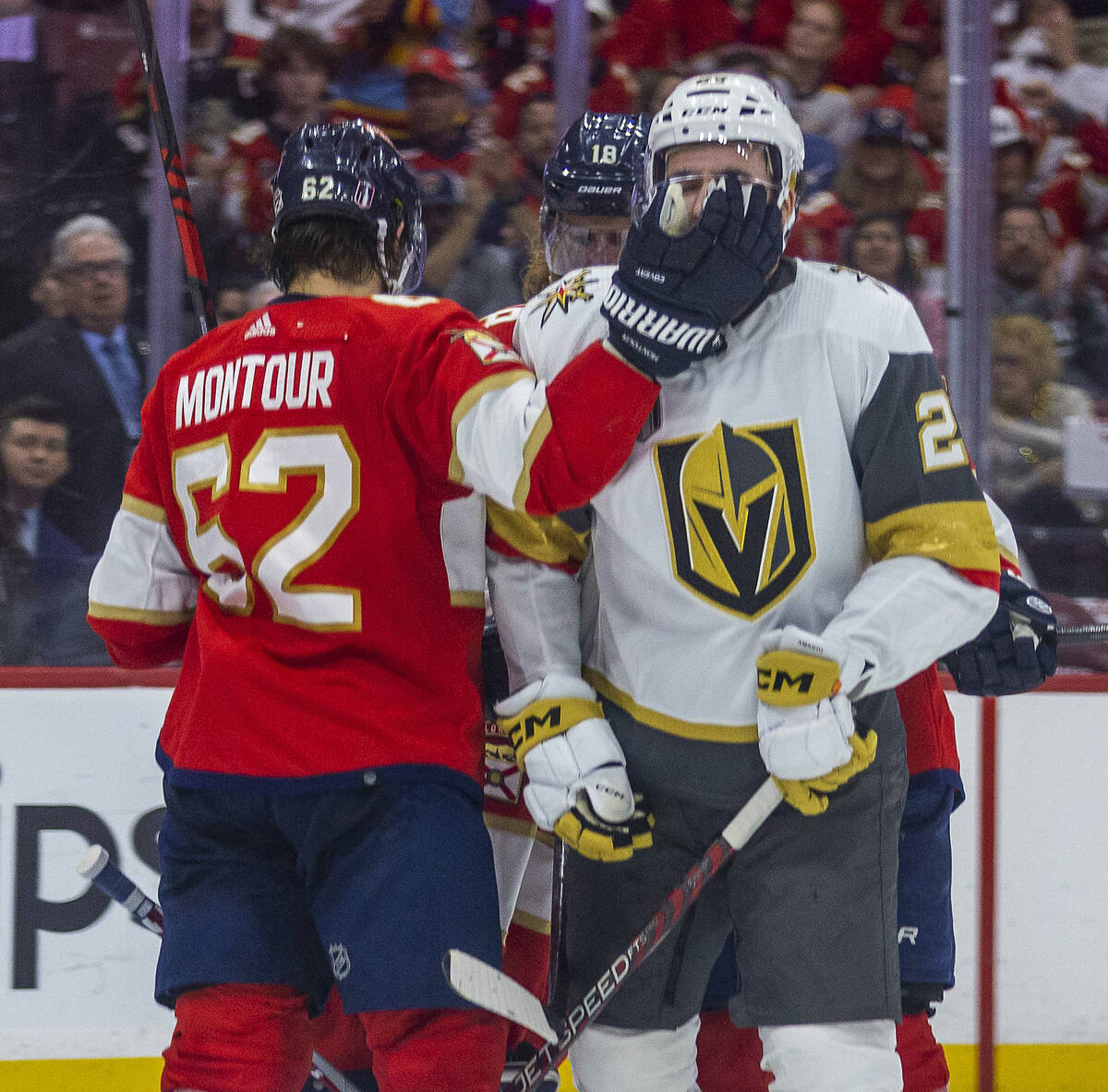 Florida Panthers defenseman Brandon Montour (62) smacks the face of Golden Knights defenseman Z ...