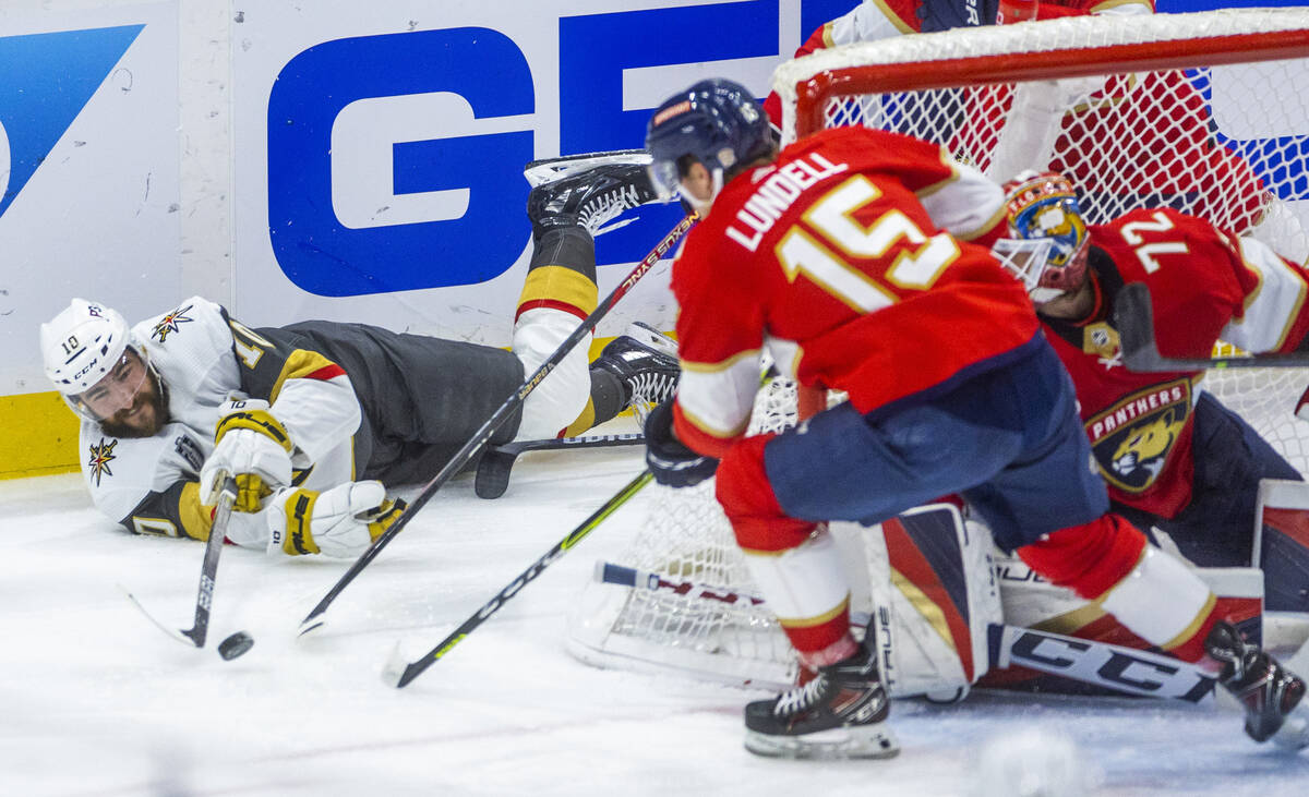 Golden Knights center Nicolas Roy (10) still attempts to pass from the ice past Florida Panther ...