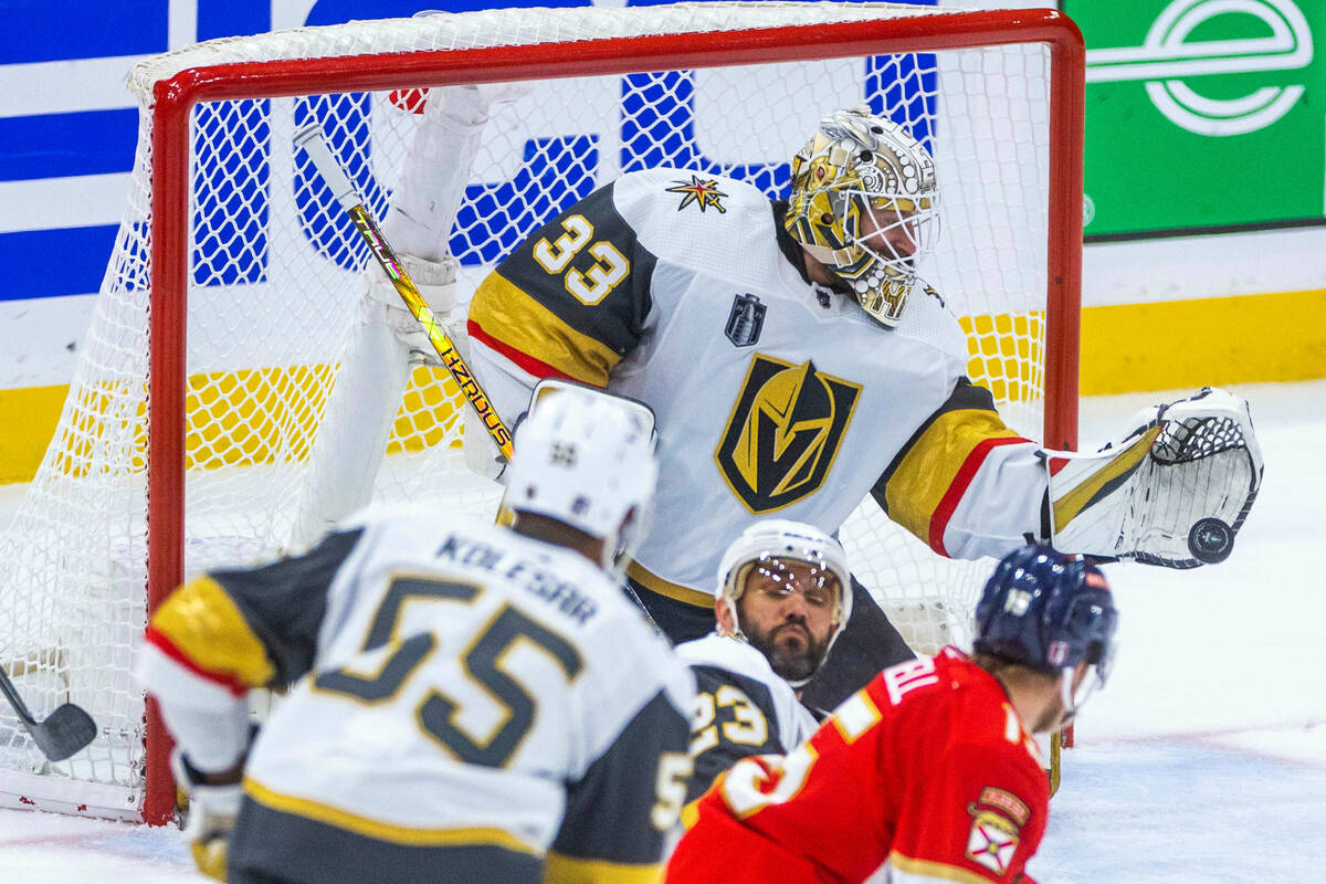 Golden Knights goaltender Adin Hill (33) makes another save against Florida Panthers defenseman ...