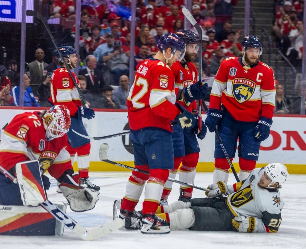 Golden Knights center Brett Howden (21) lays on the ice after being knocked down by Florida Pan ...