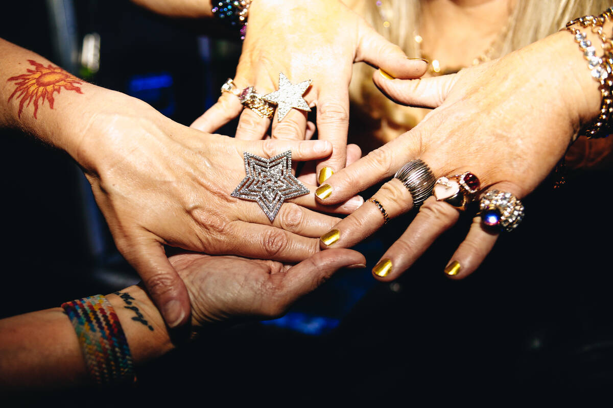 Attendees show off their jewelry at the third annual Second Chance Prom hosted by Las Vegas Tra ...