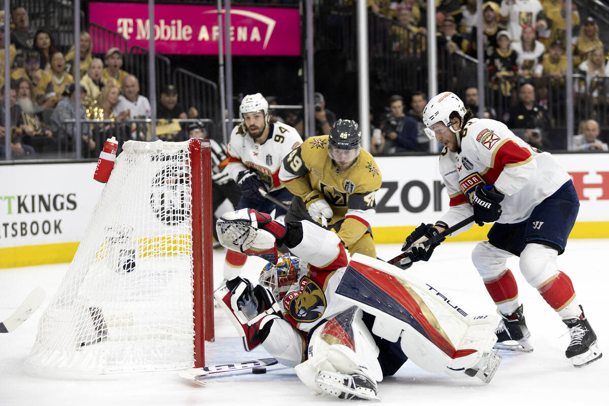 The puck gets under Florida Panthers goaltender Sergei Bobrovsky (72) for a Golden Knights goal ...