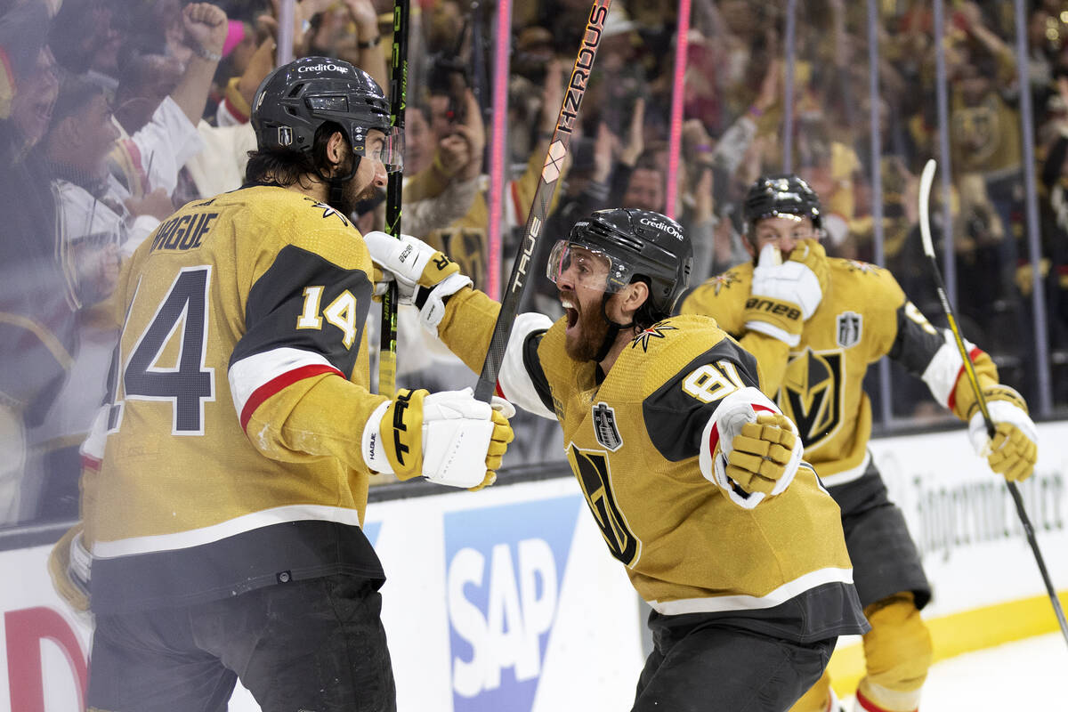 Golden Knights defenseman Nicolas Hague (14) and right wing Jonathan Marchessault (81) celebrat ...