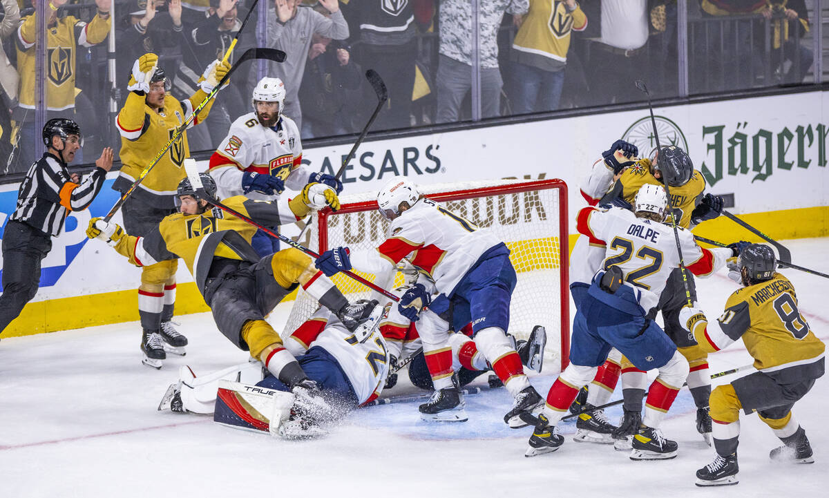 Golden Knights defenseman Nicolas Hague (14) is knocked backwards after scoring on Florida Pant ...