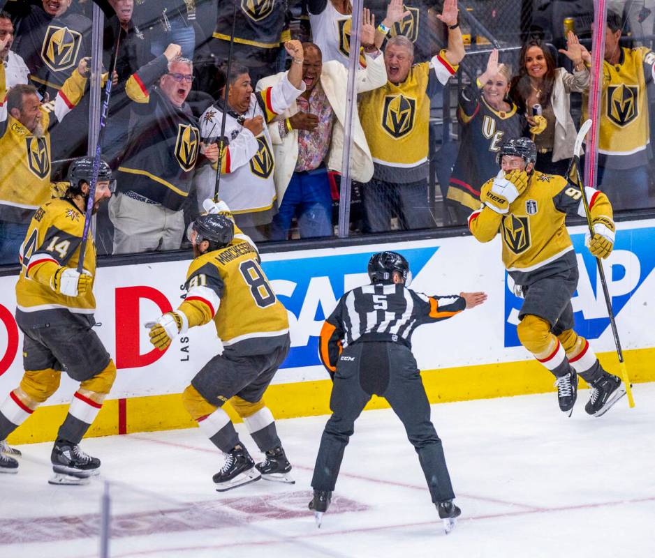 Golden Knights defenseman Nicolas Hague (14) is congratulated by right wing Jonathan Marchessau ...