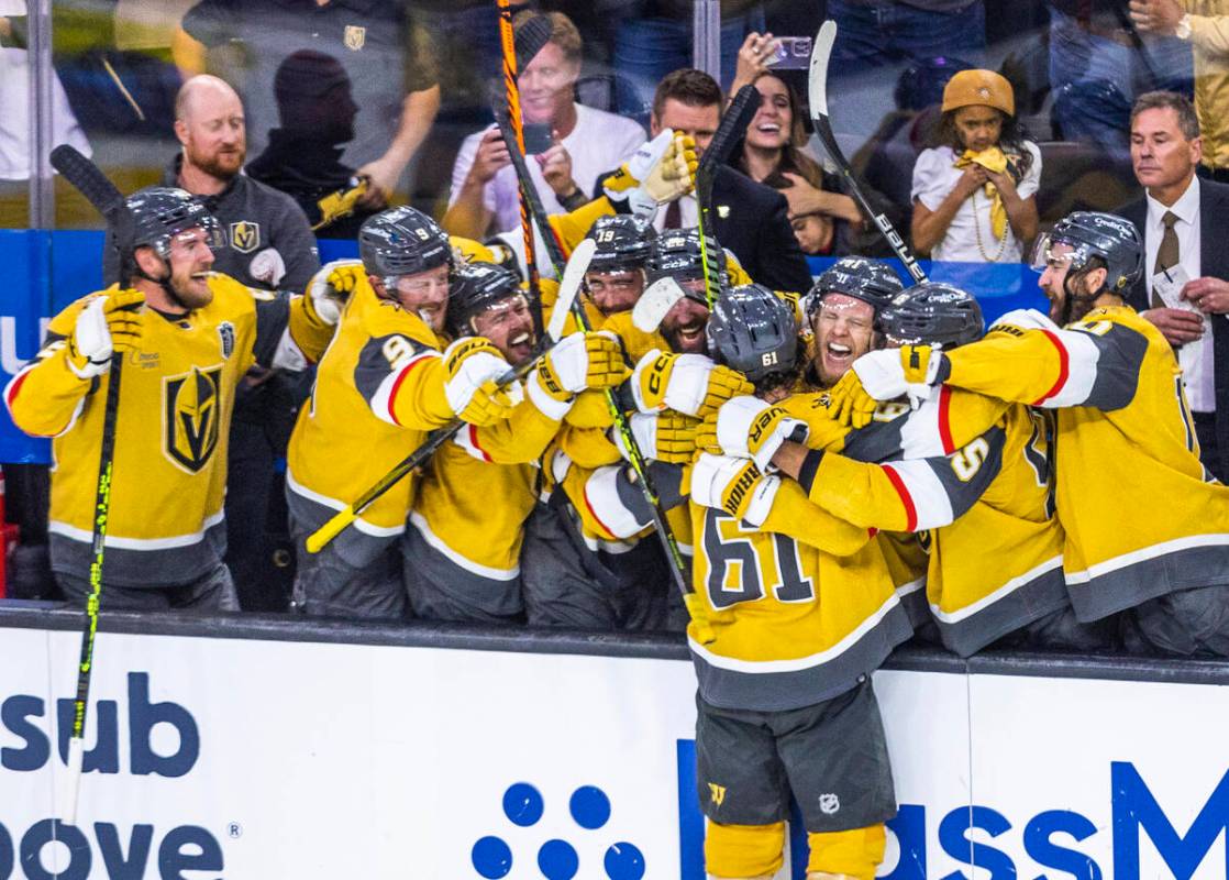 Golden Knights right wing Mark Stone (61) and teammates celebrate his hat trick goal against th ...