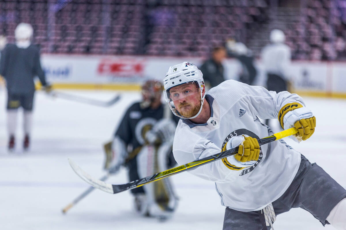 Golden Knights center Jack Eichel (9) takes a shot at the net defended by goaltender Adin Hill ...