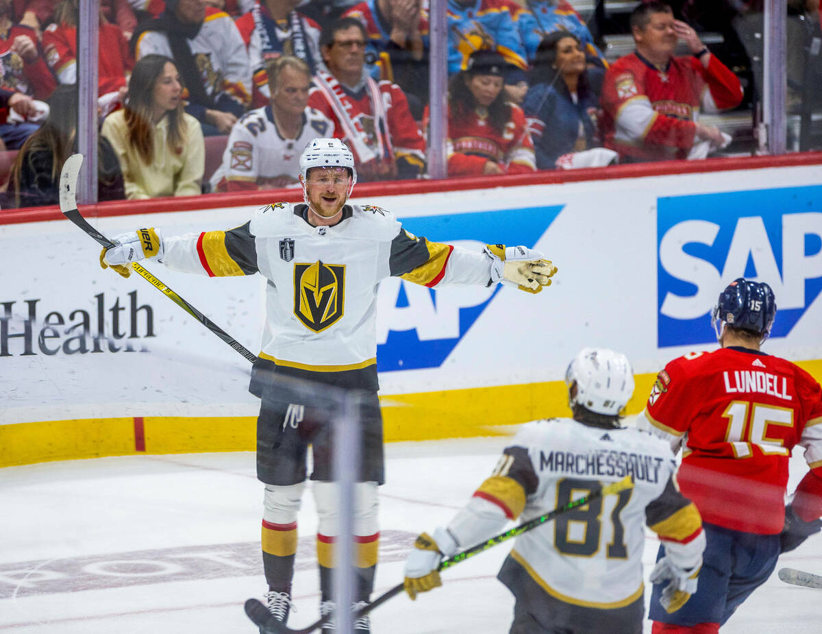 Golden Knights center Jack Eichel (9) celebrates a score with right wing Jonathan Marchessault ...