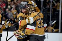 Vegas Golden Knights goaltender Adin Hill (33) and defenseman Brayden McNabb (3) celebrate afte ...