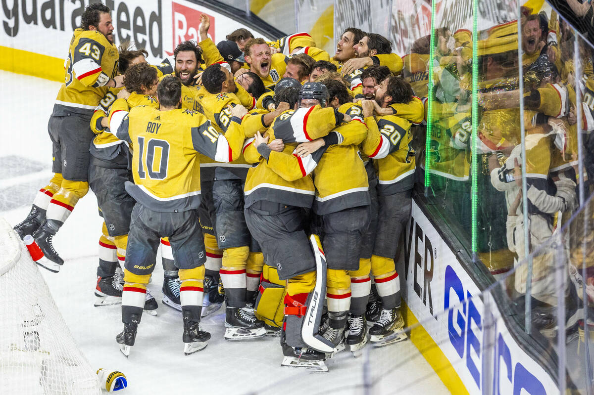 The Golden Knights players celebrate their 9-3 win over the Florida Panthers following Game 5 w ...