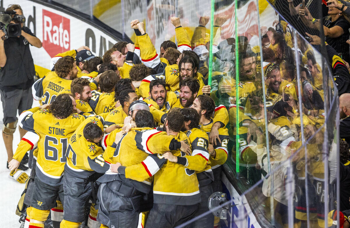 The Golden Knights players celebrate their 9-3 win over the Florida Panthers following Game 5 w ...