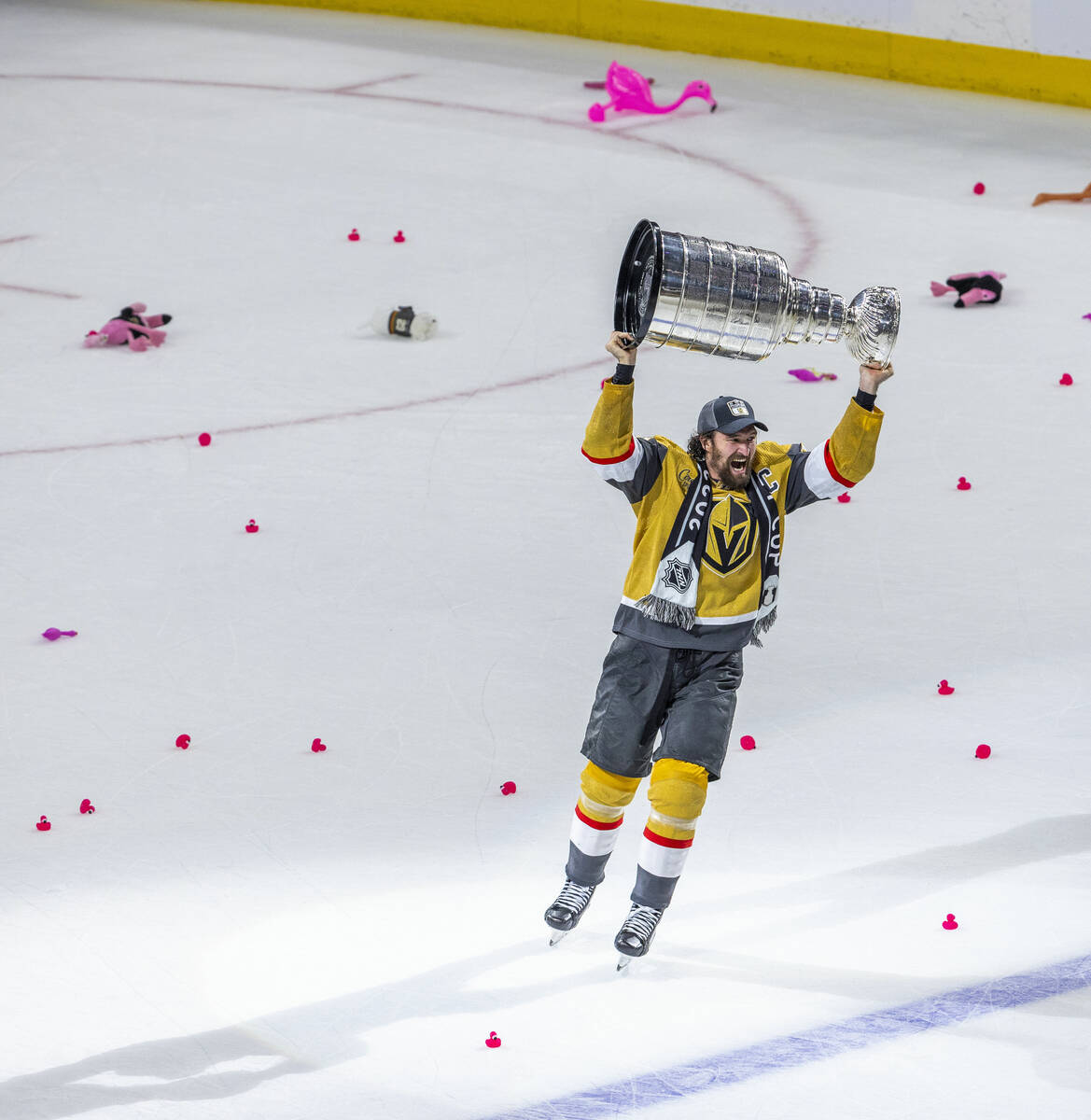 Golden Knights right wing Mark Stone (61) hoists the Stanley Cup after their 9-3 win over the F ...