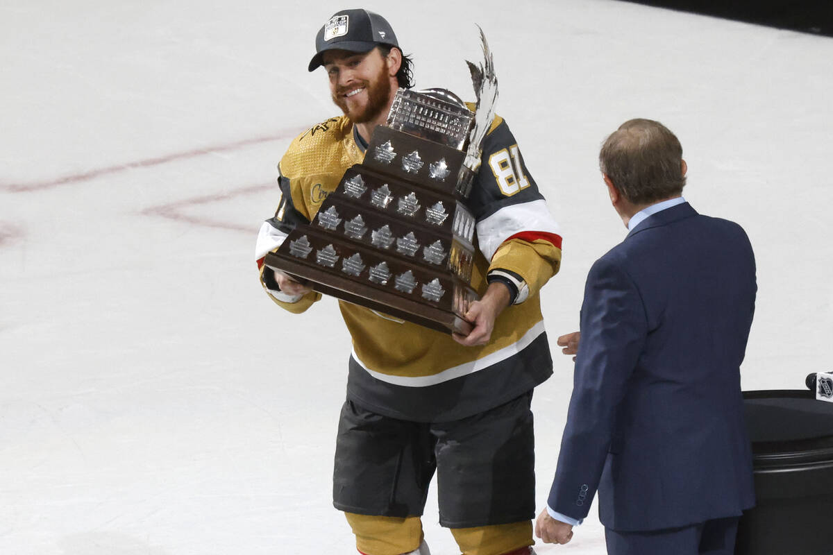 Vegas Golden Knights right wing Jonathan Marchessault hold the Conn Smythe Trophy after the Kni ...