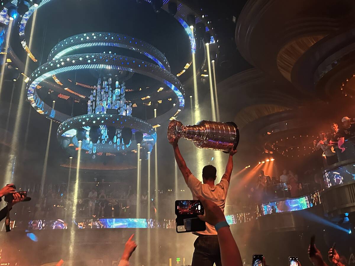 Keegan Kolesar holds aloft the Stanley Cup at Omnia at Caesars Palace after the Vegas Golden Kn ...
