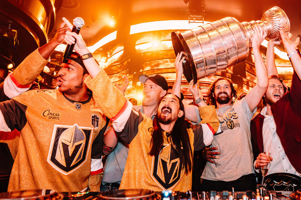 DJ Steve Aoki, center, and members of the Vegas Golden Knights celebrate the team's Stanley Cup ...