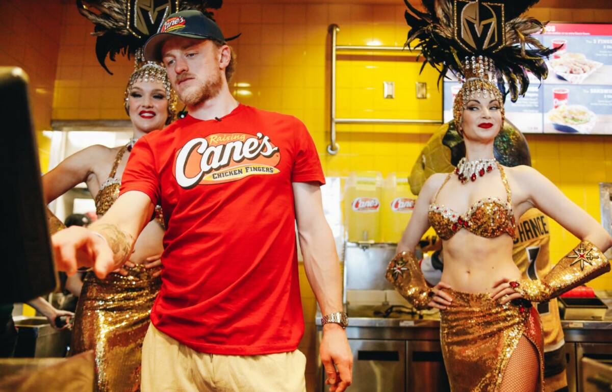 Golden Knights center Jack Eichel takes orders from fans inside of Raising Canes in Las Vegas. ...