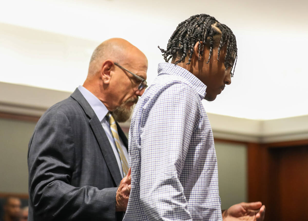 Former UNLV basketball recruit Zaon Collins alongside his attorney, Frank Kocka, waits to enter ...