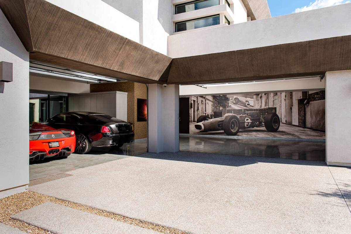 This home in The Ridges in Summerlin was designed to show off the owner's car collection. (Blue ...