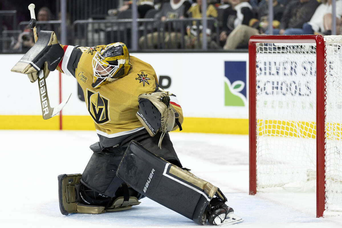 Golden Knights goaltender Laurent Brossoit (39) saves the puck during the second period in Game ...