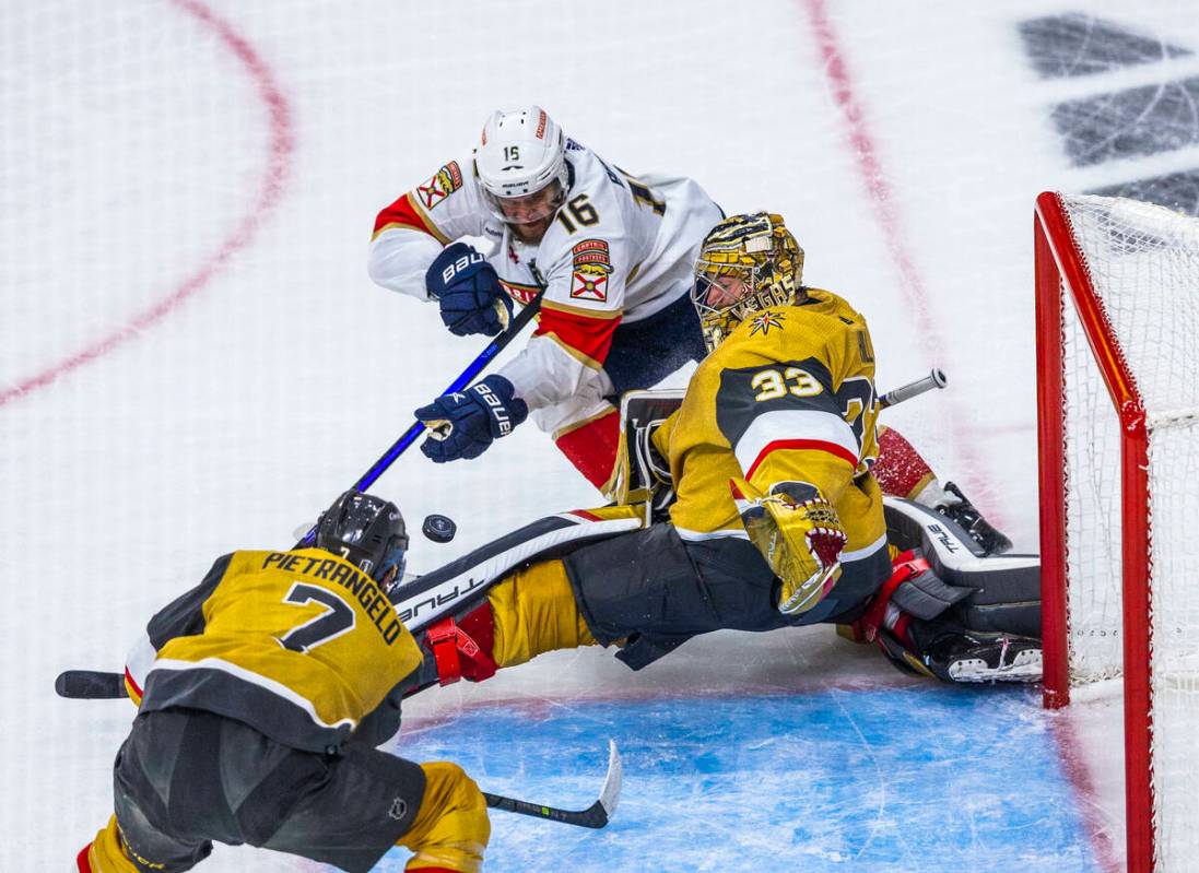 Golden Knights goaltender Adin Hill (33) saves a goal attempt by Florida Panthers center Aleksa ...