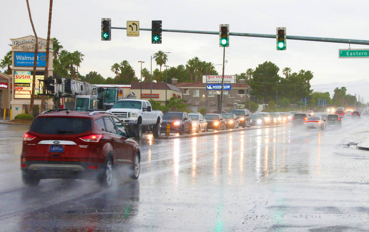 A car drives through the intersection of Warms Springs road and Eastern avenue during an early ...