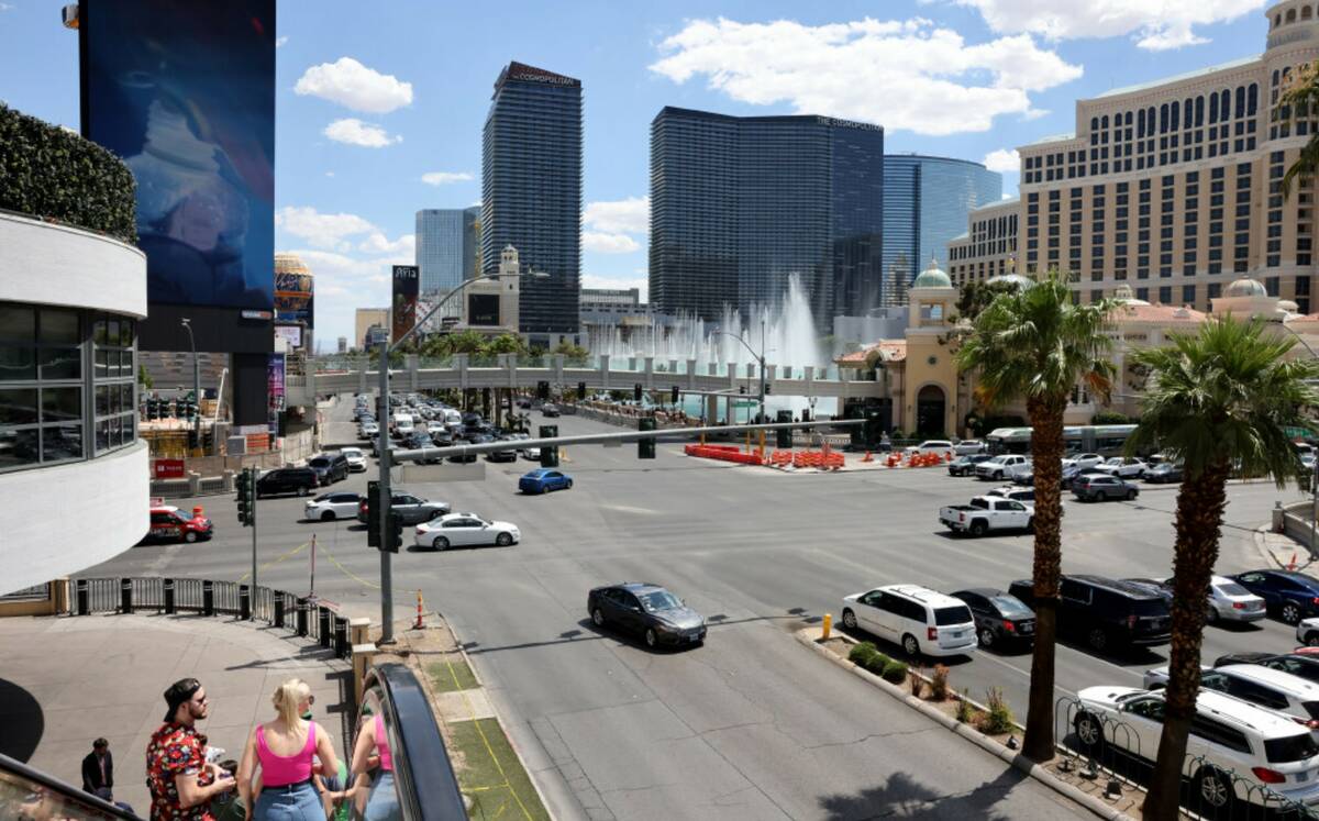 Traffic and pedestrians move at the intersection of Las Vegas Boulevard and Flamingo Road on th ...