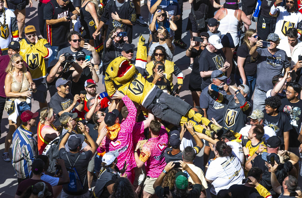 Golden Knights mascot Chance crowd surfs amongst fans in Toshiba Plaza before Game 2 of the Sta ...