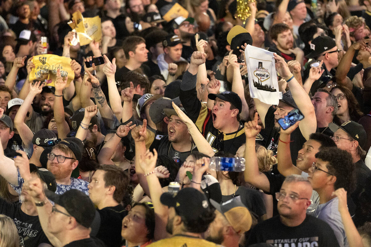 The Golden Knights fans go wild for TV cameras as the Knights parade down Las Vegas Boulevard t ...