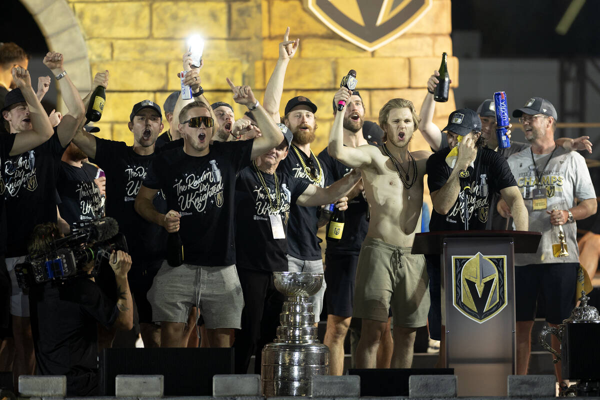 Golden Knights right wing Mark Stone, second from right, tears up while giving a speech during ...