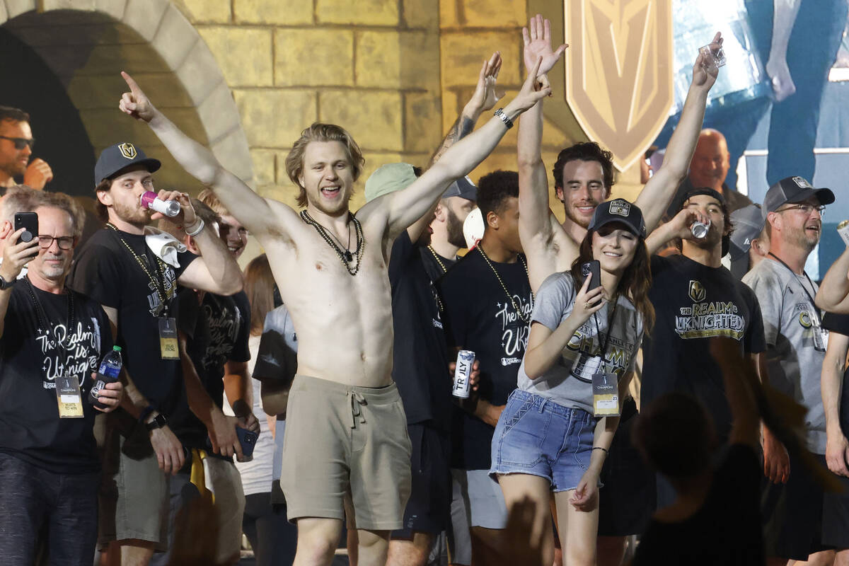 Golden Knights center William Karlsson, left, poses on the stage during a rally at Toshiba Plaz ...