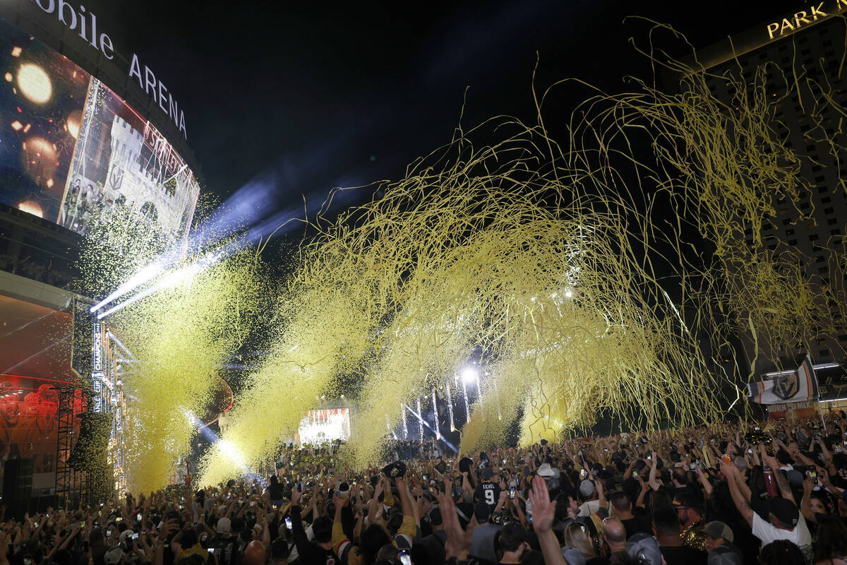 People celebrate during a rally at Toshiba Plaza after the Golden Knights’ NHL hockey St ...